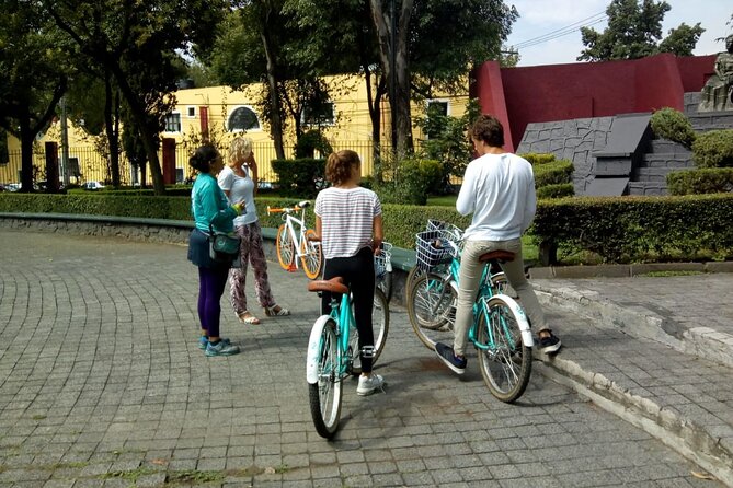 Frida's Heart Guided Biking Tour in Coyoacán - Plaza Centenario: fountains, a cathedral view, and alleys that feel lived-in