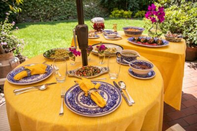 Gourmet Home Dining Experience in Mexico City with Margarita - Garden welcome drinks and stories from Margarita