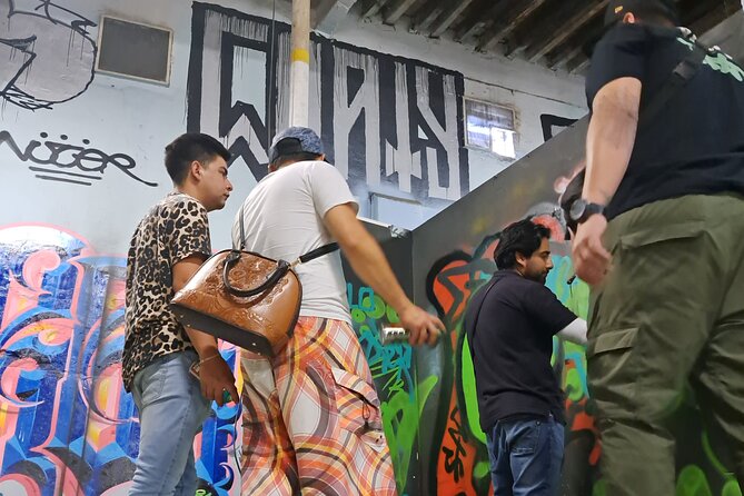 Tour Evolution of Muralism paints your Grafiti - Abelardo L. Rodríguez Market murals: politics painted overhead