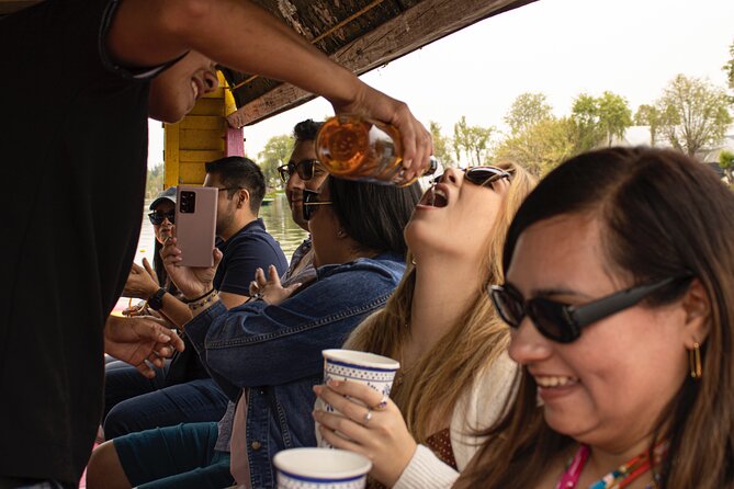 Xochimilco BOAT LIGHT PARTY WITH 1 DRINK AND 4 TAQUITOES + 18 - Value check: is $49 a good deal for an adult Xochimilco boat party?